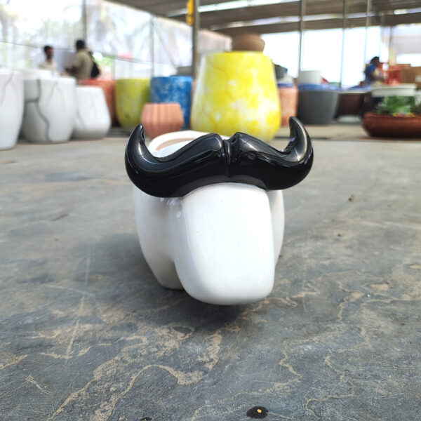 POC000308WT-b Charming ceramic buffalo planter, perfect for adding a playful touch to indoor décor with small plants or succulents.