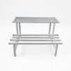 PS06MT0015b Two-tier white galvanised steel plant stand with elevated rectangular top and slatted lower shelf. Rust-resistant, powder-coated finish with protective feet, ideal for indoor or outdoor plant displays.