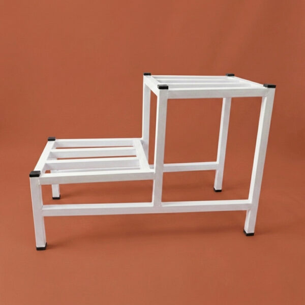 Two-tier white galvanised steel plant stand with slatted platforms and protective foot caps. Rust-resistant, powder-coated finish creates a stylish stepped display for indoor or outdoor greenery.