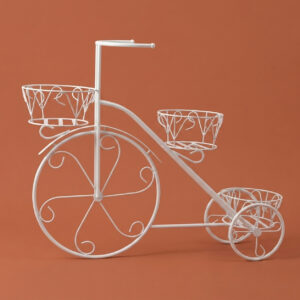 Charming vintage tricycle-shaped white galvanised steel plant stand with three decorative scrolled baskets. Rust-resistant, powder-coated finish adds whimsical, eye-catching garden décor for displaying plants outdoors.