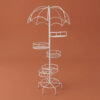 Tall white galvanised steel plant stand with an umbrella-shaped canopy top and six staggered circular tiers. Rust-resistant, powder-coated finish creates a whimsical, statement multi-plant display.